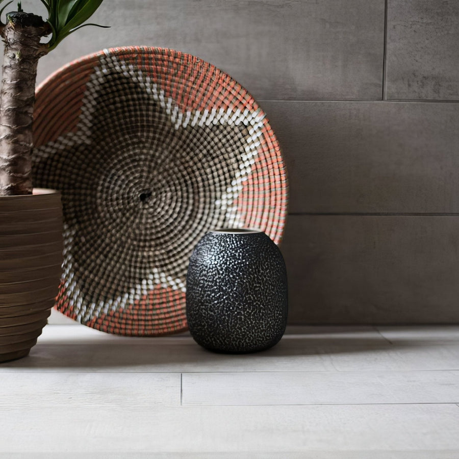 Black speckled ceramic vase made of brasilia cinza matt glazed porcelain with a smooth matte finish