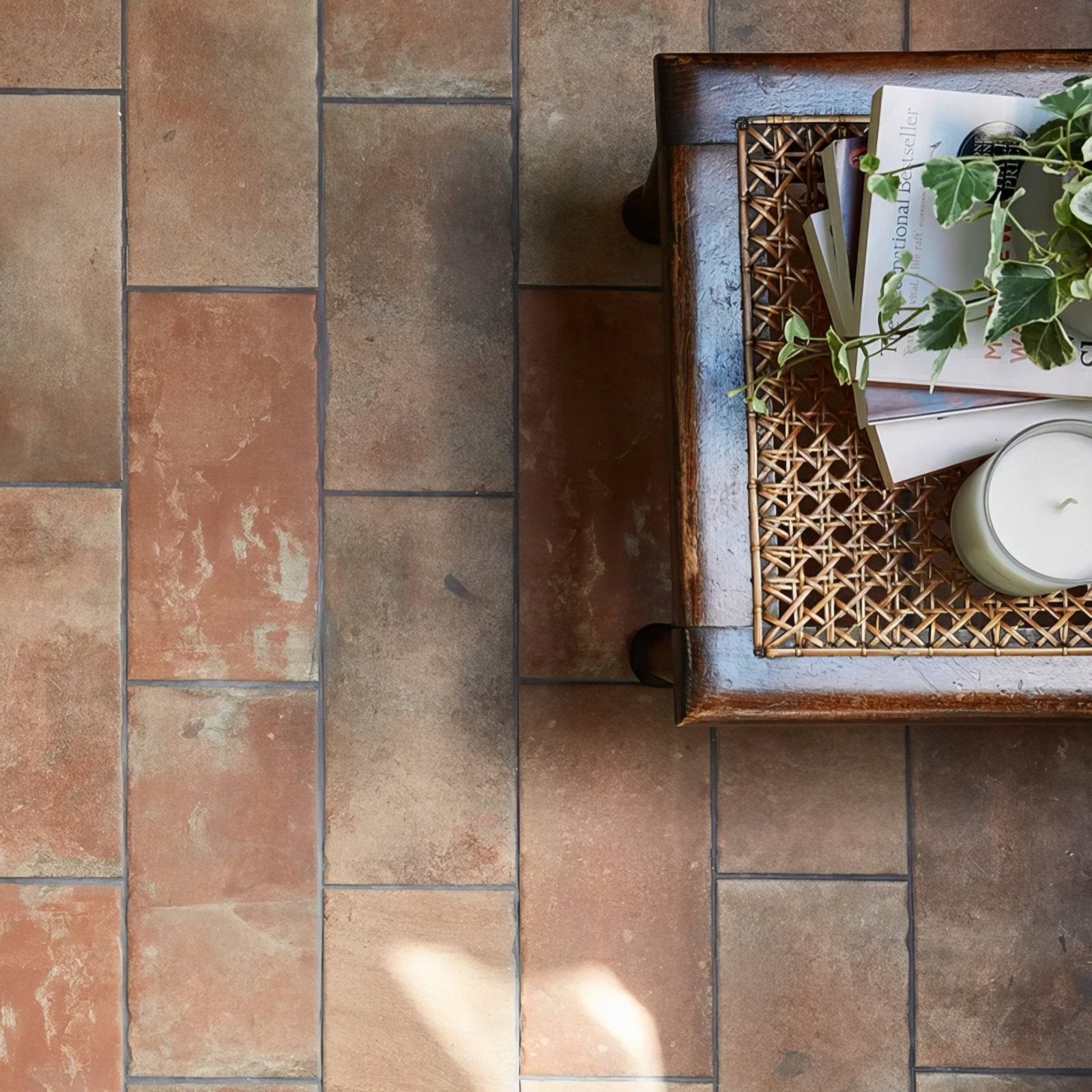 Rustic brewhouse porcelain brick tile floor with warm earthy terracotta tones and subtle color variations
