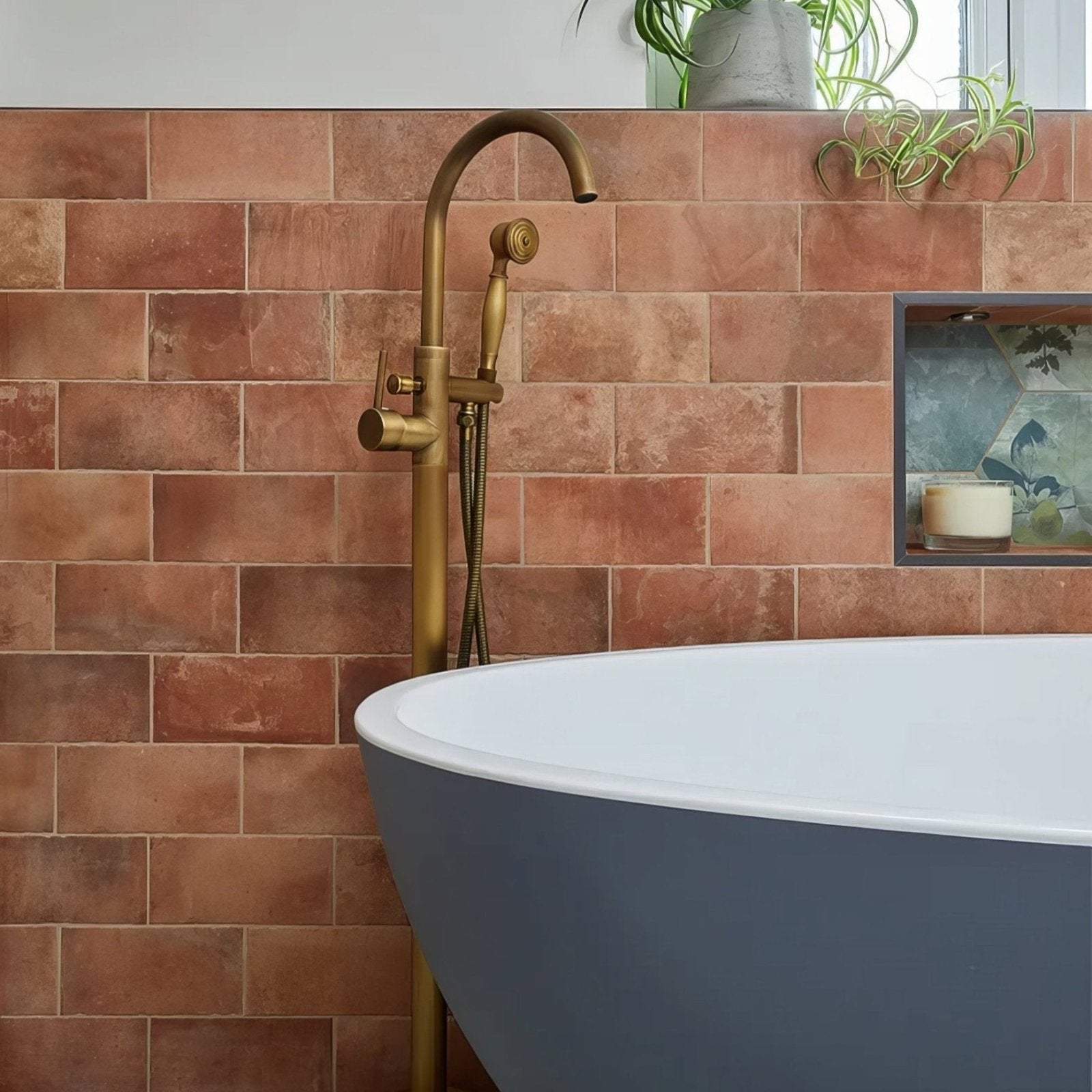 Brass freestanding bathtub faucet with curved spout and handheld showerhead for brewhouse porcelain brick tub