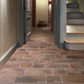 Brewhouse porcelain rectangle floor tiles in terracotta color with a rustic textured finish for indoor use