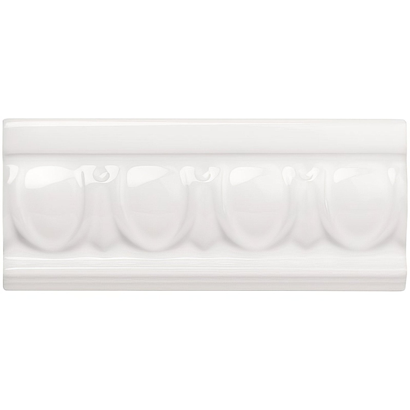 Brilliant white egg and dart moulding featuring white ceramic crown tile with glossy finish and oval relief pattern