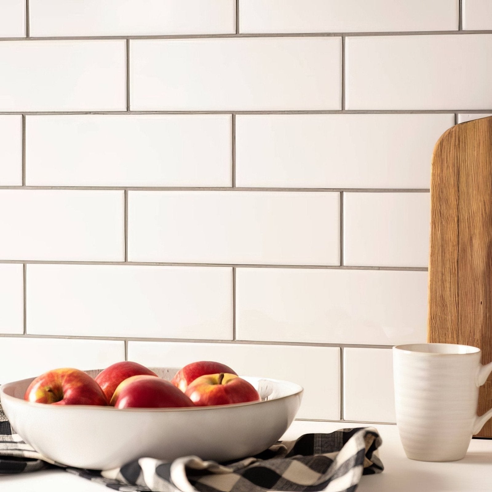 Brilliant white large brick ceramic bowl filled with red and yellow apples for stylish fruit display