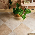 A lush green philodendron plant in a textured golden brown ceramic pot displayed on brit stone minster porcelain 60 x 60cm