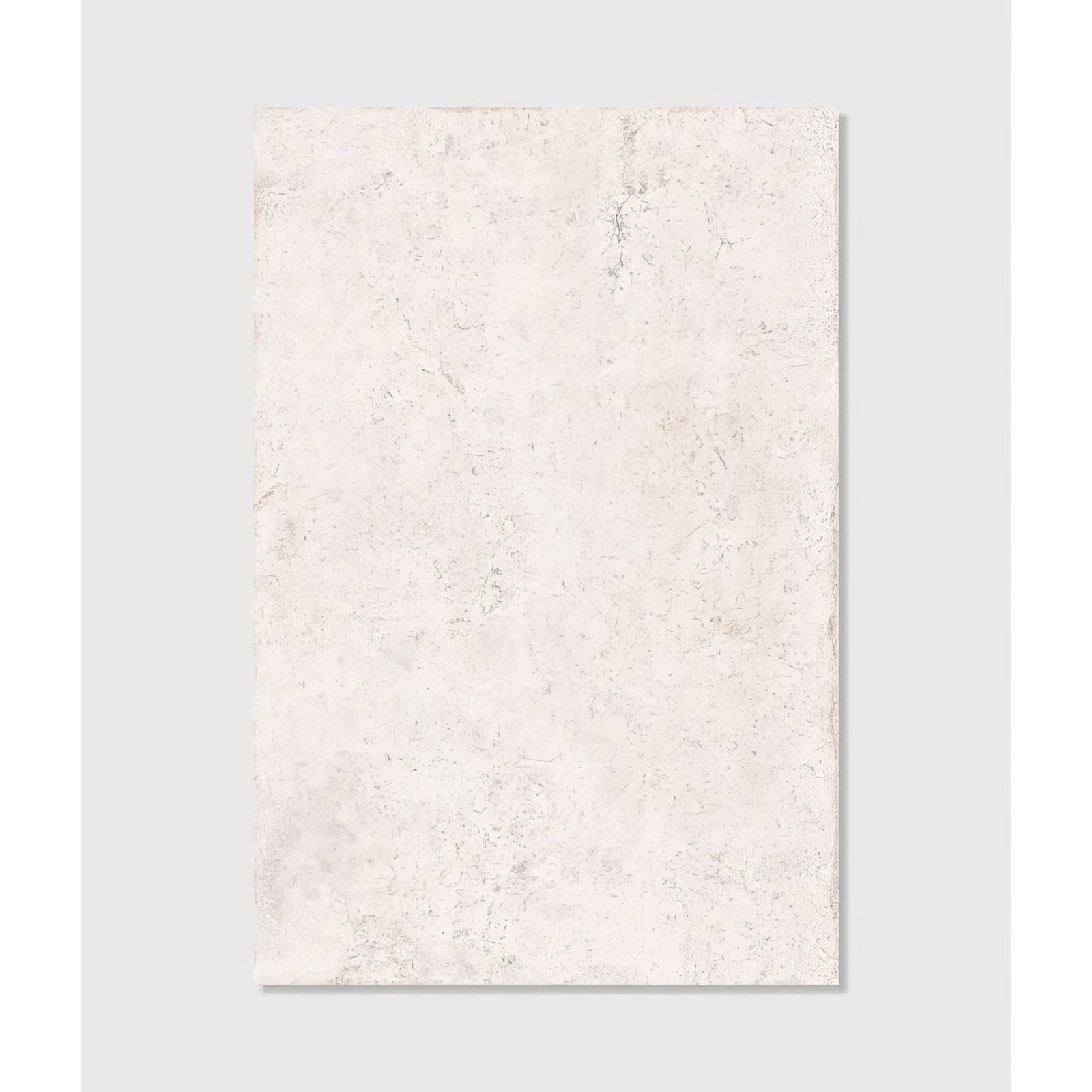 Cream-colored brit stone minster porcelain paving tile with subtle texture and faint gray veining on surface
