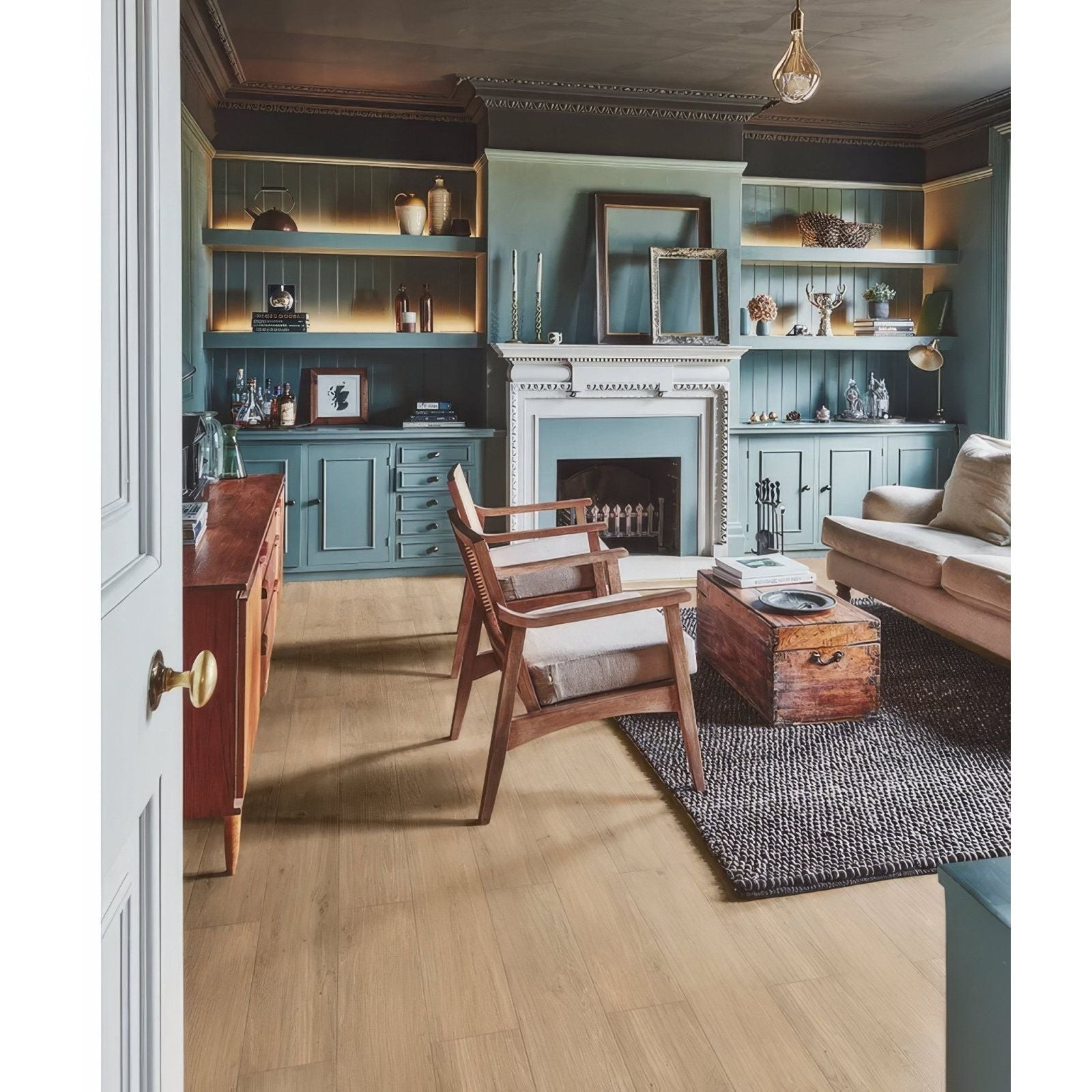 Antique wooden trunk with metal handles and weathered finish paired with burley minerale plank click tile flooring