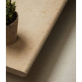 Beige buscot limestone etched bullnose coping with a subtle textured stone countertop surface and rounded edges