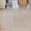Beige stone tiles with subtle natural veining and polished finish in buscot limestone honed finish design