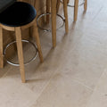 Beige buscot limestone tile with honed matte finish and subtle natural veining ideal for interior flooring