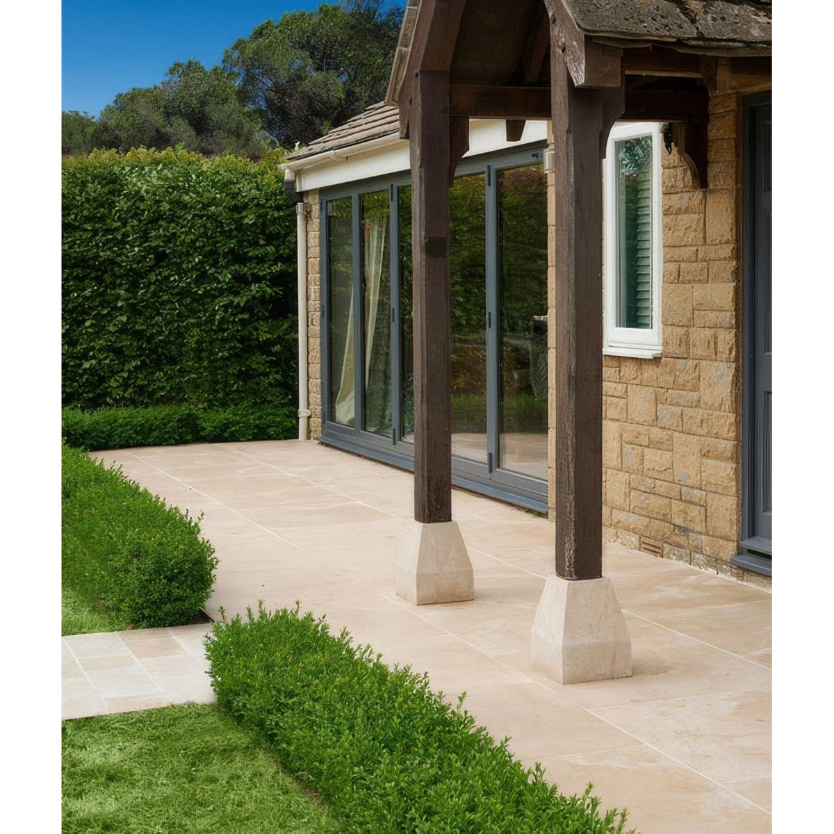 Beige buscot limestone paving tiles with a smooth polished finish ideal for outdoor patios and walkways