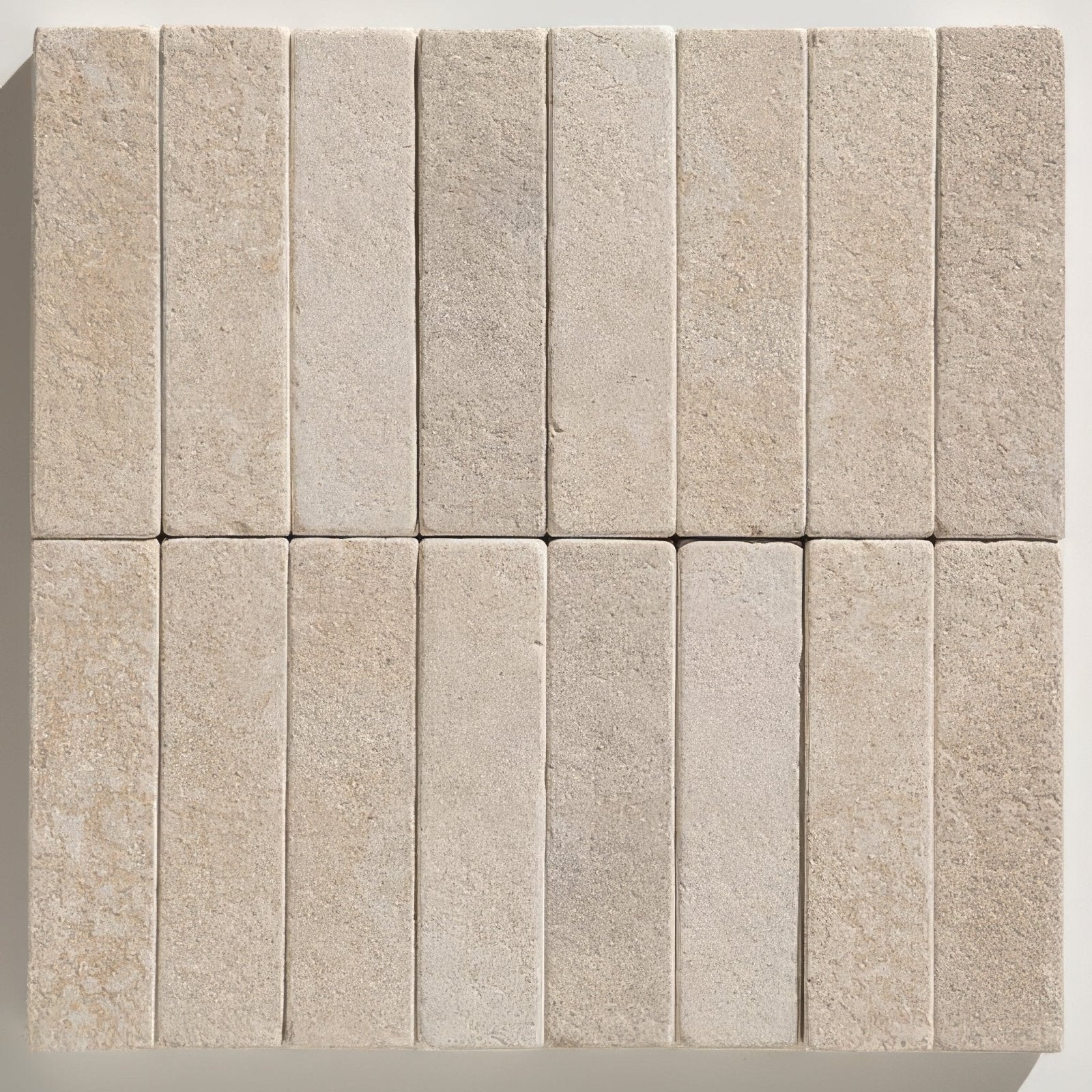 Beige rectangular buscot limestone tumbled and etched klinkers with textured natural stone surface