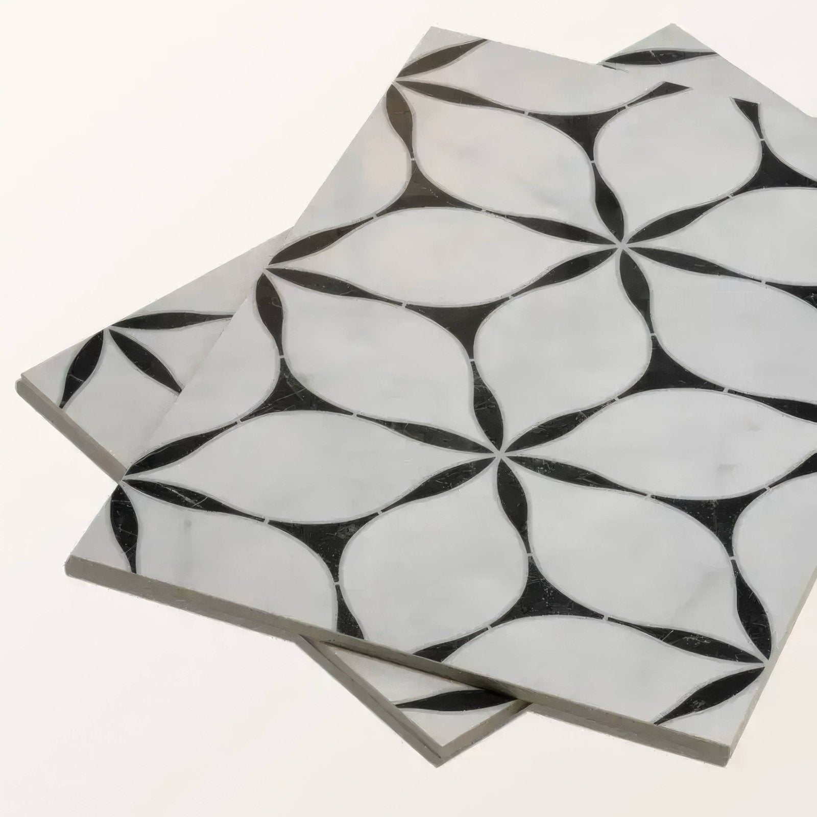 Black and white marble mosaic tiles with geometric floral pattern made of porcelain for decorative flooring