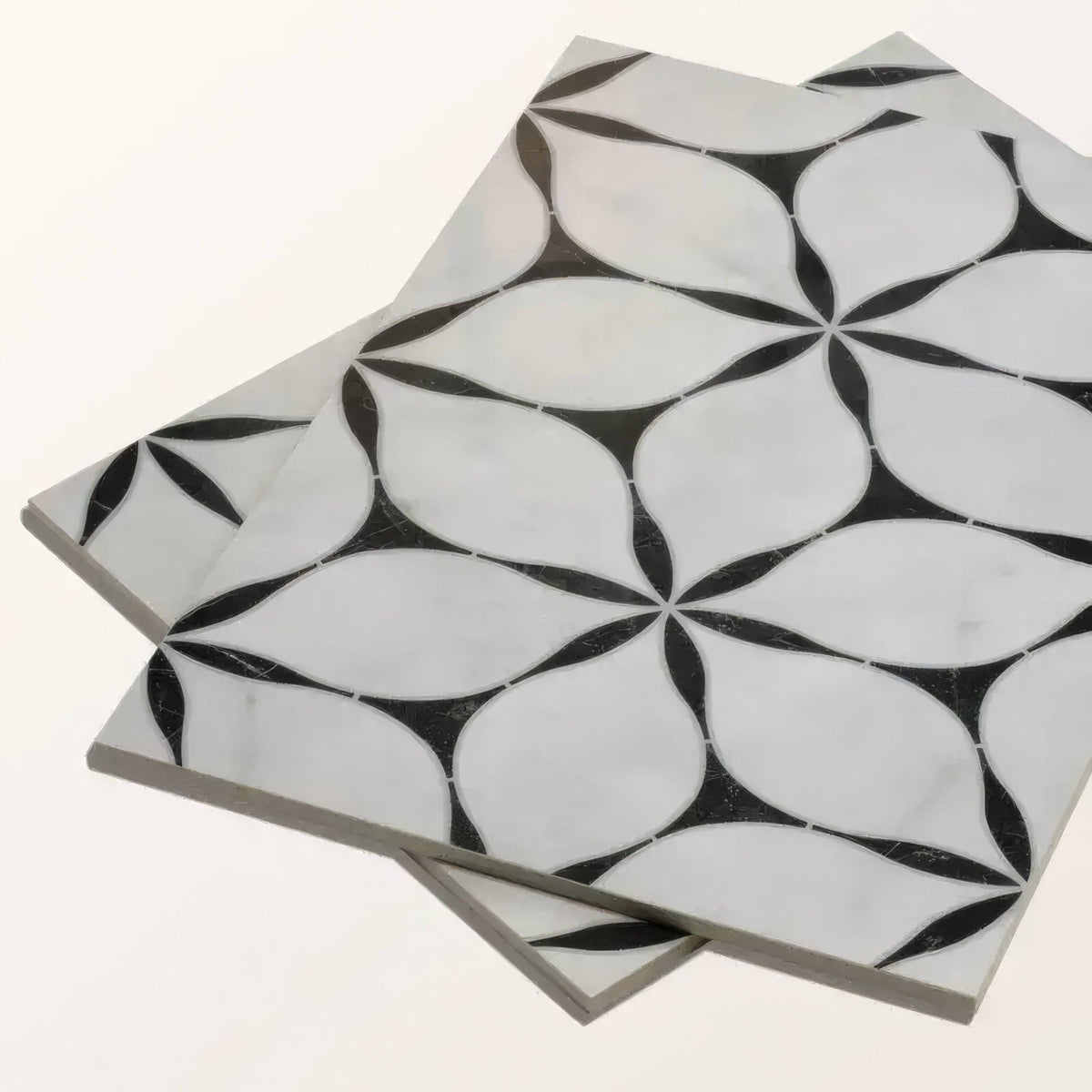 Black and white marble mosaic tiles with geometric floral pattern made of porcelain for decorative flooring