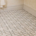 Byzantine porcelain forum sculpted beige and gray geometric patterned floor tiles with subtle marble-like finish