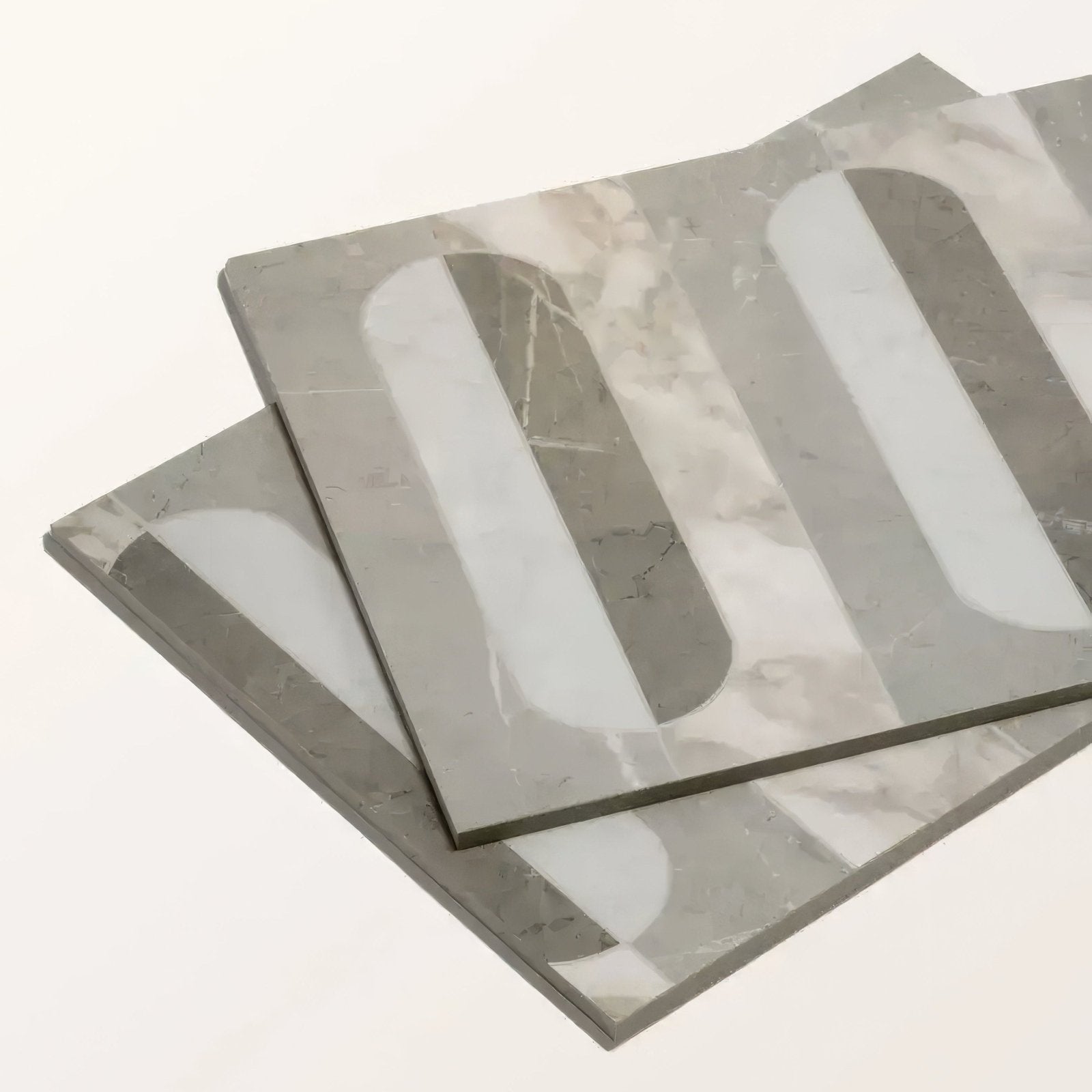 Gray and white marble effect square porcelain tiles with bold curved vertical stripes from byzantine palation sculpted collection