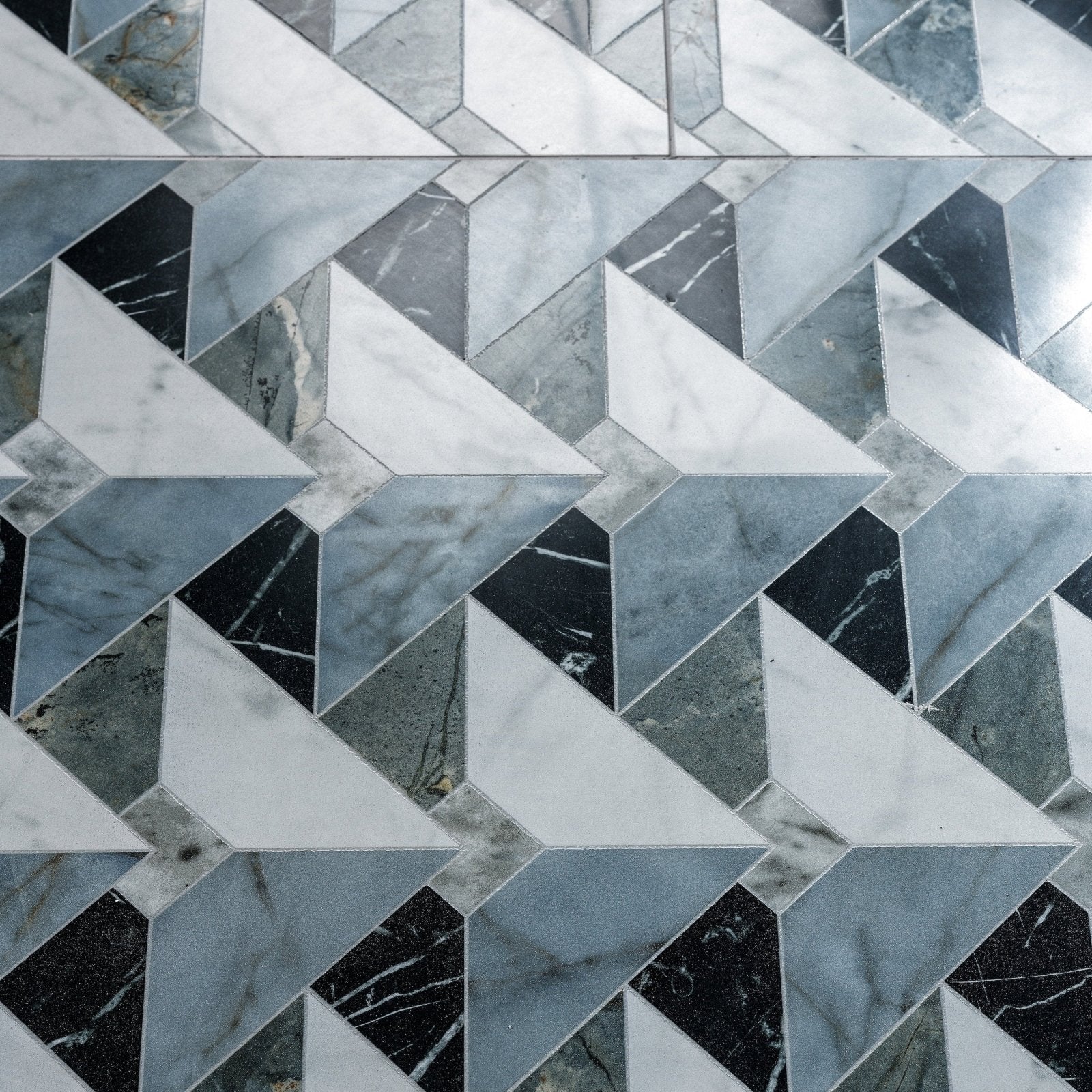 Byzantine porcelain seraph sculpted geometric mosaic tile pattern with interlocking white black and gray marble triangles