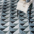 Geometric marble tile floor in herringbone pattern with black white and gray shades for Byzantine Porcelain Seraph Sculpted