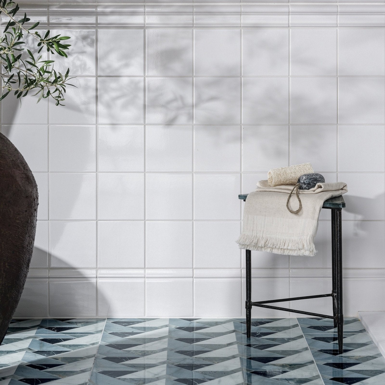 White rectangular porcelain wall tiles with subtle gray veining from byzantine porcelain seraph sculpted collection