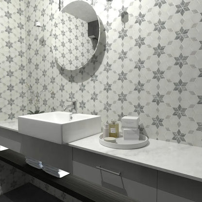 Close detail of grey marble star points set into honed Carrara White in the starline mosaic