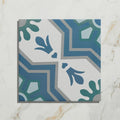 Square cabana porcelain algarve tile with vintage geometric pattern in blue teal and gray on white background