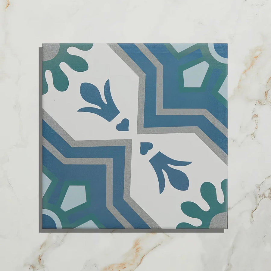 Square cabana porcelain algarve tile with vintage geometric pattern in blue teal and gray on white background