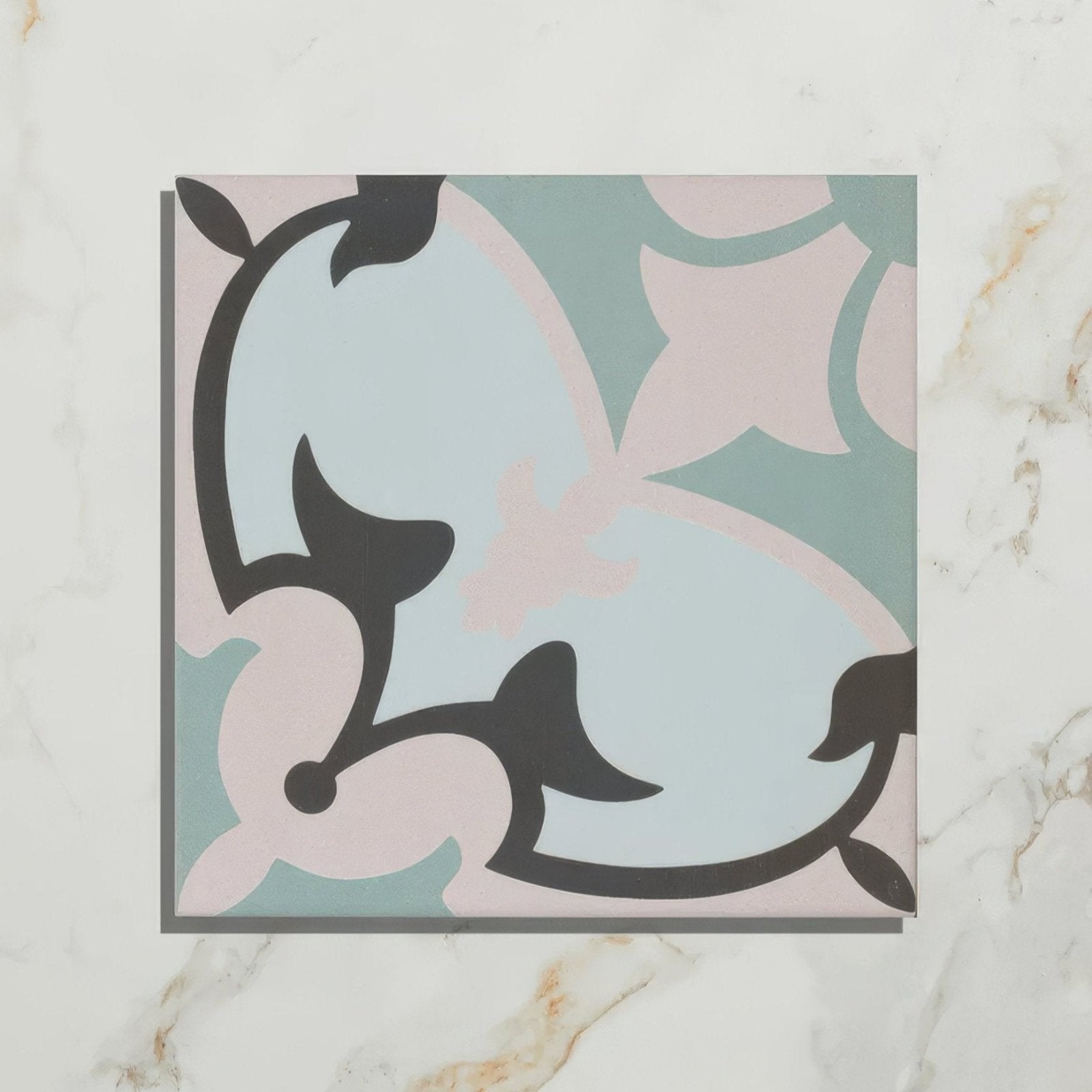 A square Cabana porcelain tile Le Marais with a delicate floral pattern in pastel pink and light blue outlined in black