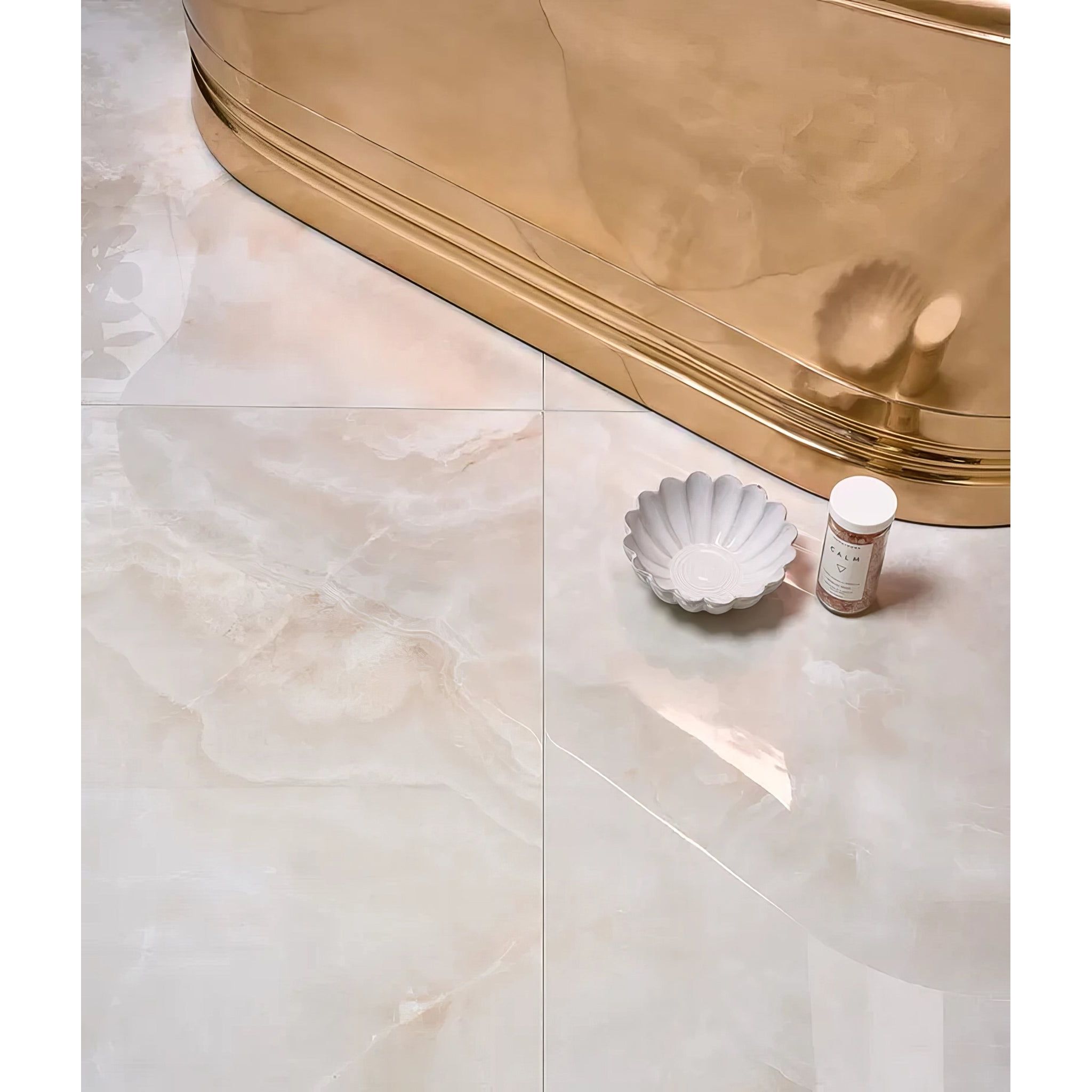 California Porcelain Beige beige marble-effect floor tiles with a white scalloped ceramic bowl