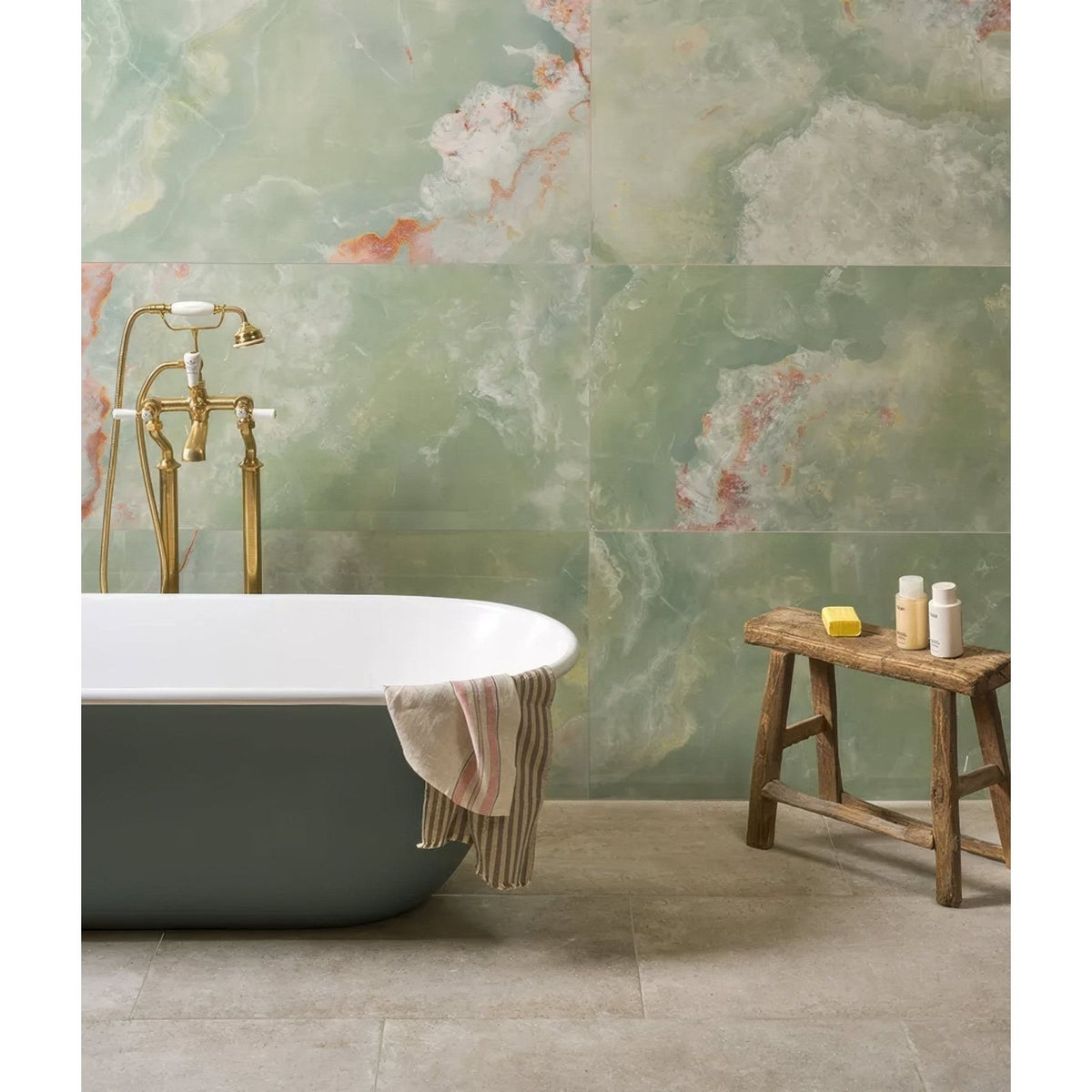 California Porcelain Jade green marble-effect tiles with a freestanding bathtub