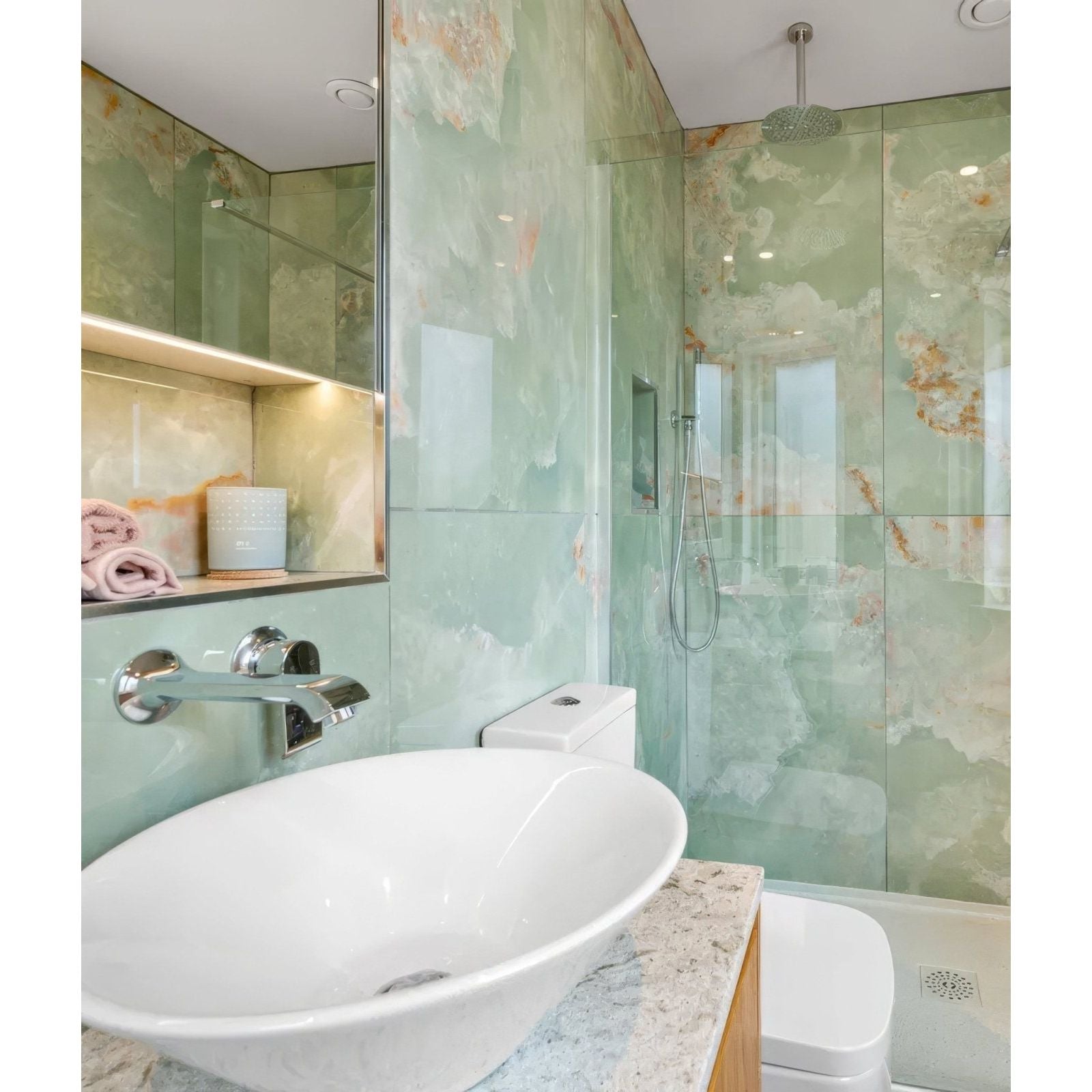 California Porcelain Jade green marble-effect tiles with a white oval sink and chrome tap