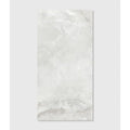 A sleek rectangular white marble California porcelain pearl tile with subtle gray veining and a glossy finish