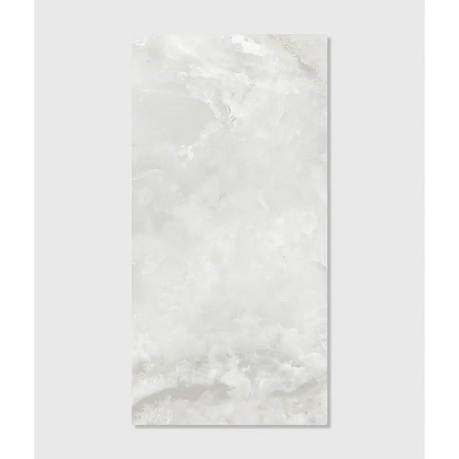 A sleek rectangular white marble California porcelain pearl tile with subtle gray veining and a glossy finish