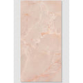 A rectangular peach-colored marble tile with subtle veining and glossy finish from california porcelain rose collection