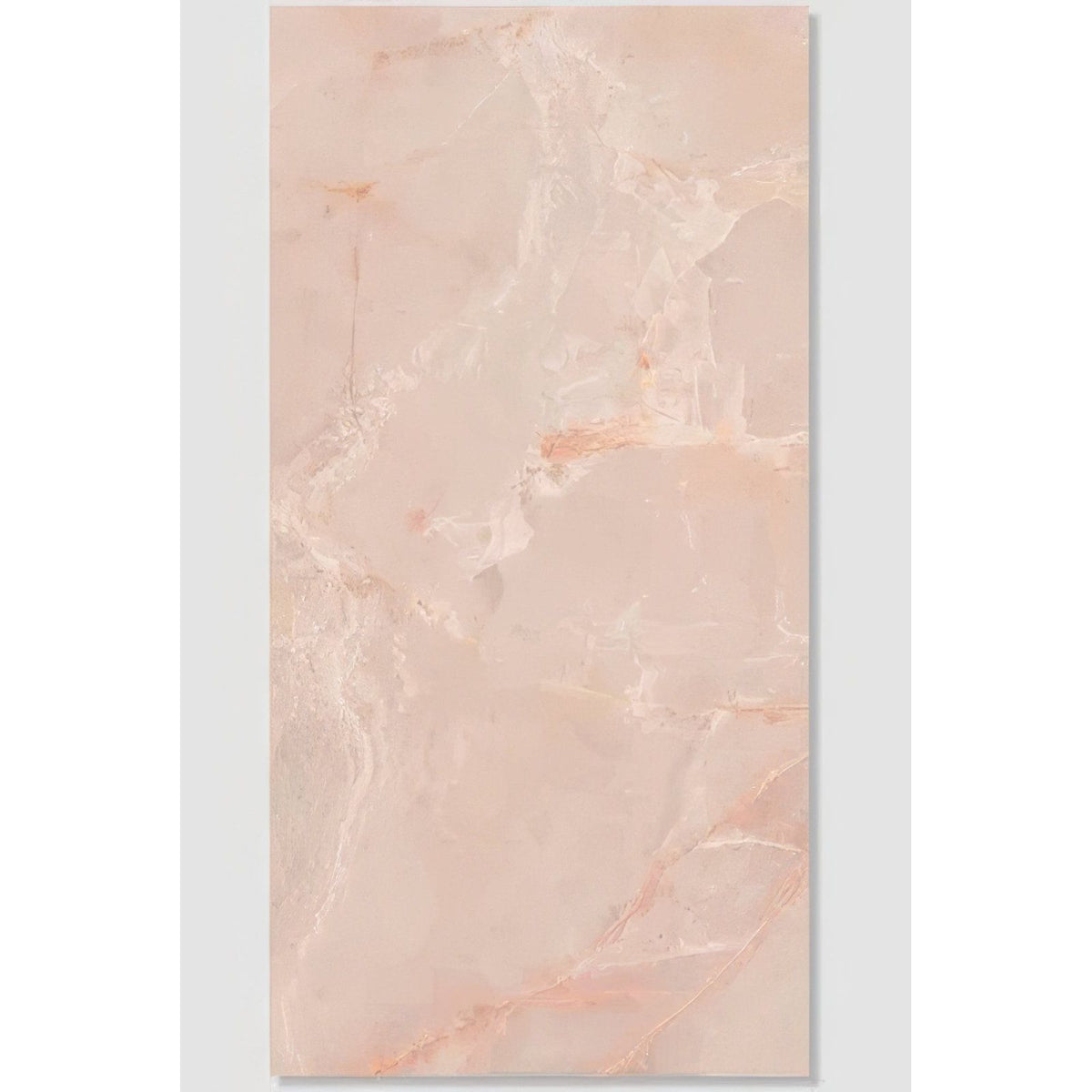 A rectangular peach-colored marble tile with subtle veining and glossy finish from california porcelain rose collection