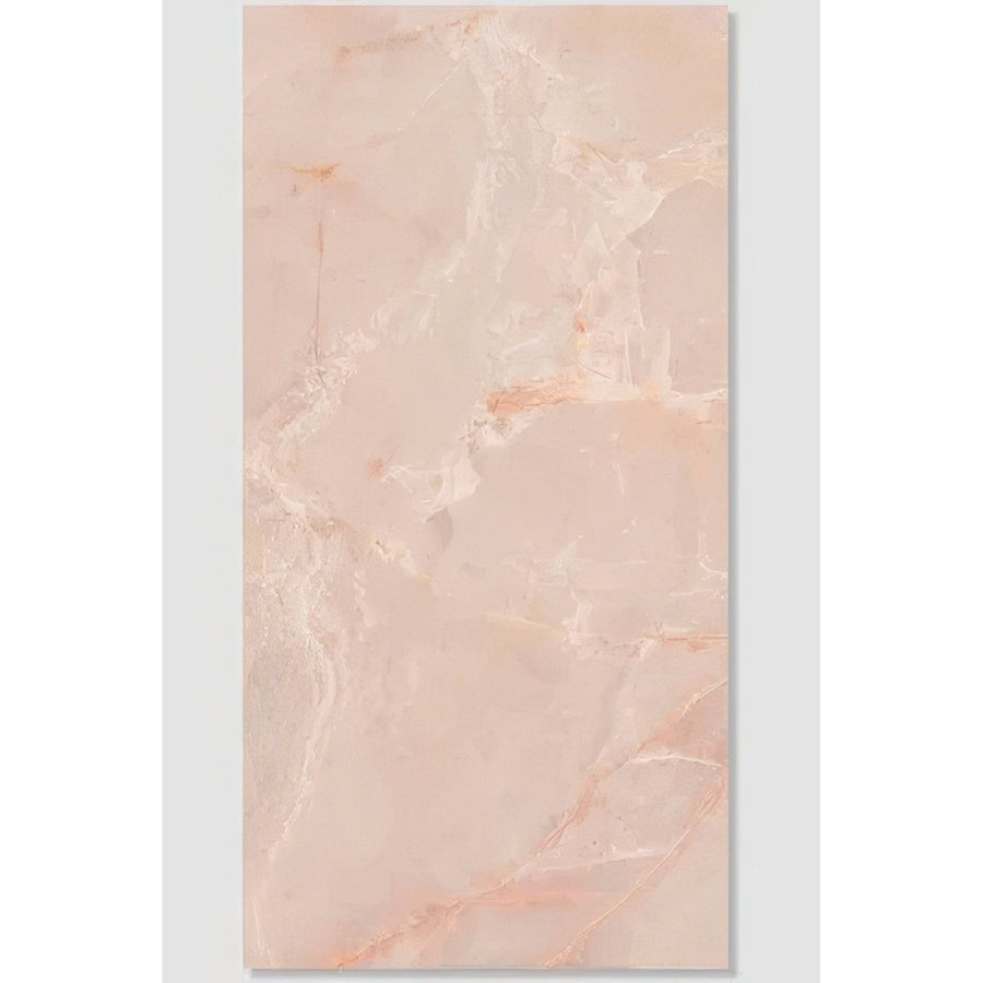 A rectangular peach-colored marble tile with subtle veining and glossy finish from california porcelain rose collection