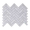 Carrara white herringbone mosaic tile featuring white marble mosaic tiles arranged in a herringbone pattern