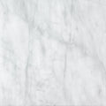 White marble tile with subtle gray veining from carrara white and red marble honed chequerboard tiles collection