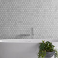 Carrara white polished hexagon mosaic tile features white marble-effect bathroom tiles with subtle gray veining