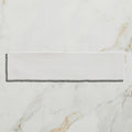 Carter ceramic white is a sleek rectangular white ceramic tile with a smooth glossy finish on a marble surface