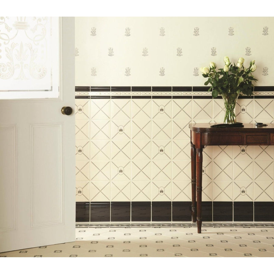 Cream-colored diamond-patterned wall tiles with black border accents in sovereign crown charcoal grey on county white