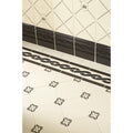 Cartouche with Sovereign Crown Charcoal Grey on County White shown as flooring