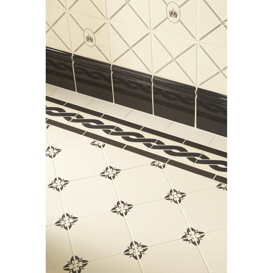 Cartouche with Sovereign Crown Charcoal Grey on County White shown as flooring
