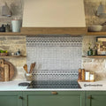 Black and white patterned ceramic tile backsplash with ornate border design casino baccarat patterned tile