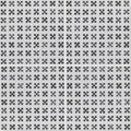 Casino baccarat patterned tile featuring black x-shaped ceramic tiles arranged in a grid on a light gray background