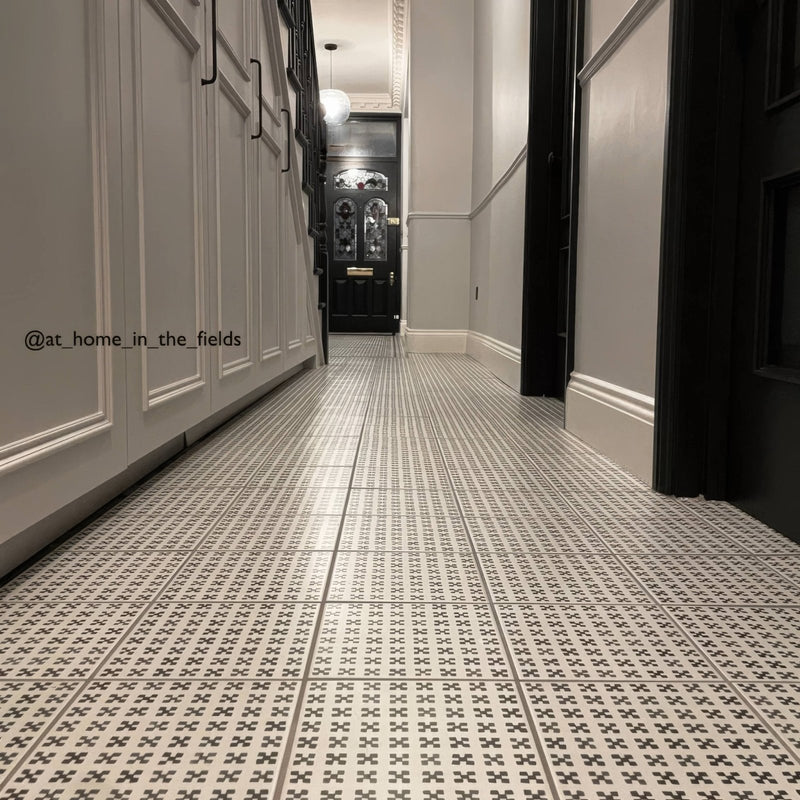 Black and white casino baccarat patterned tile featuring a repeating geometric design for floor use