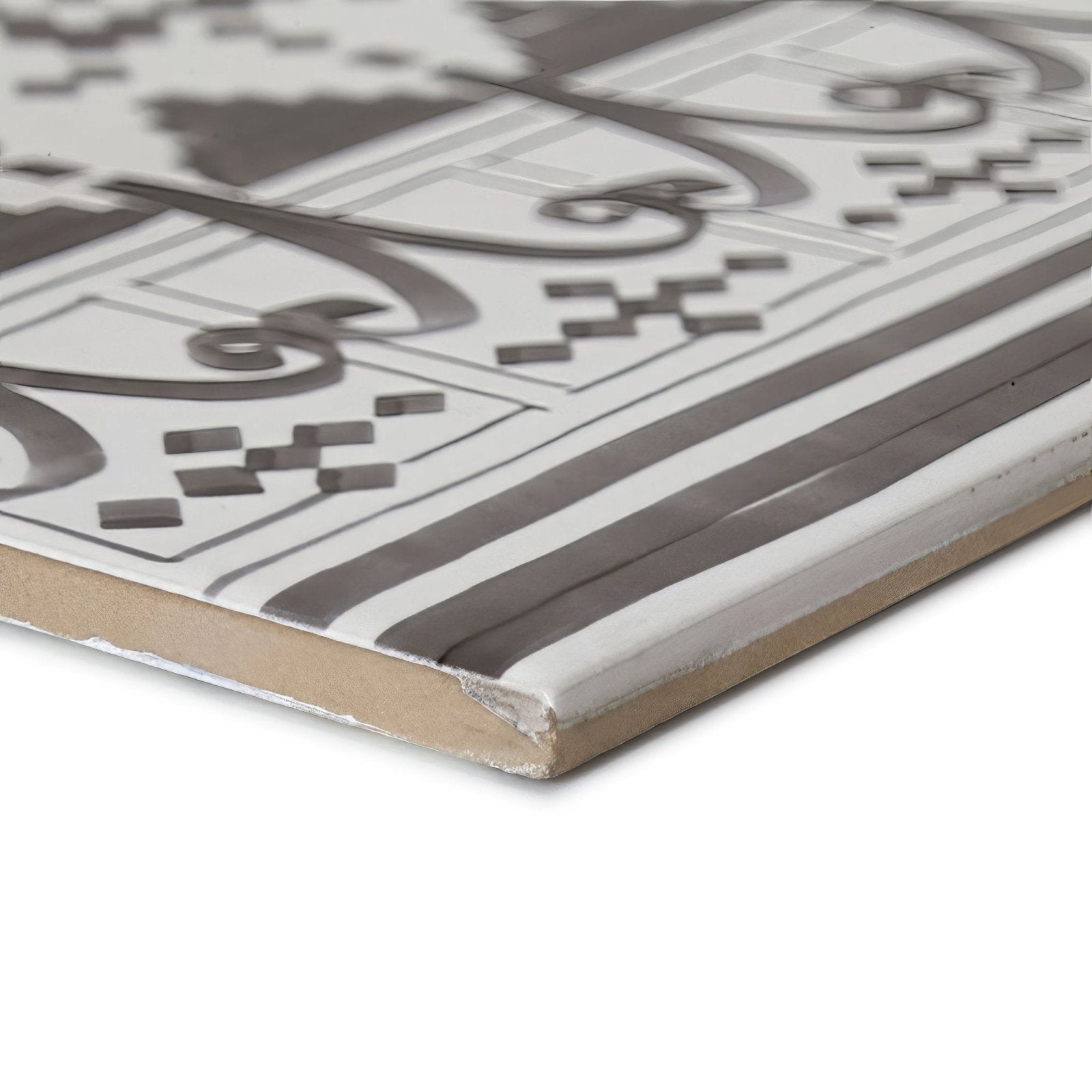Gray and white ceramic tile with intricate geometric and curvilinear casino dealer patterned border design