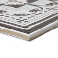 A casino dealer corner tile ceramic square with white and gray geometric pattern raised lines and beveled edge