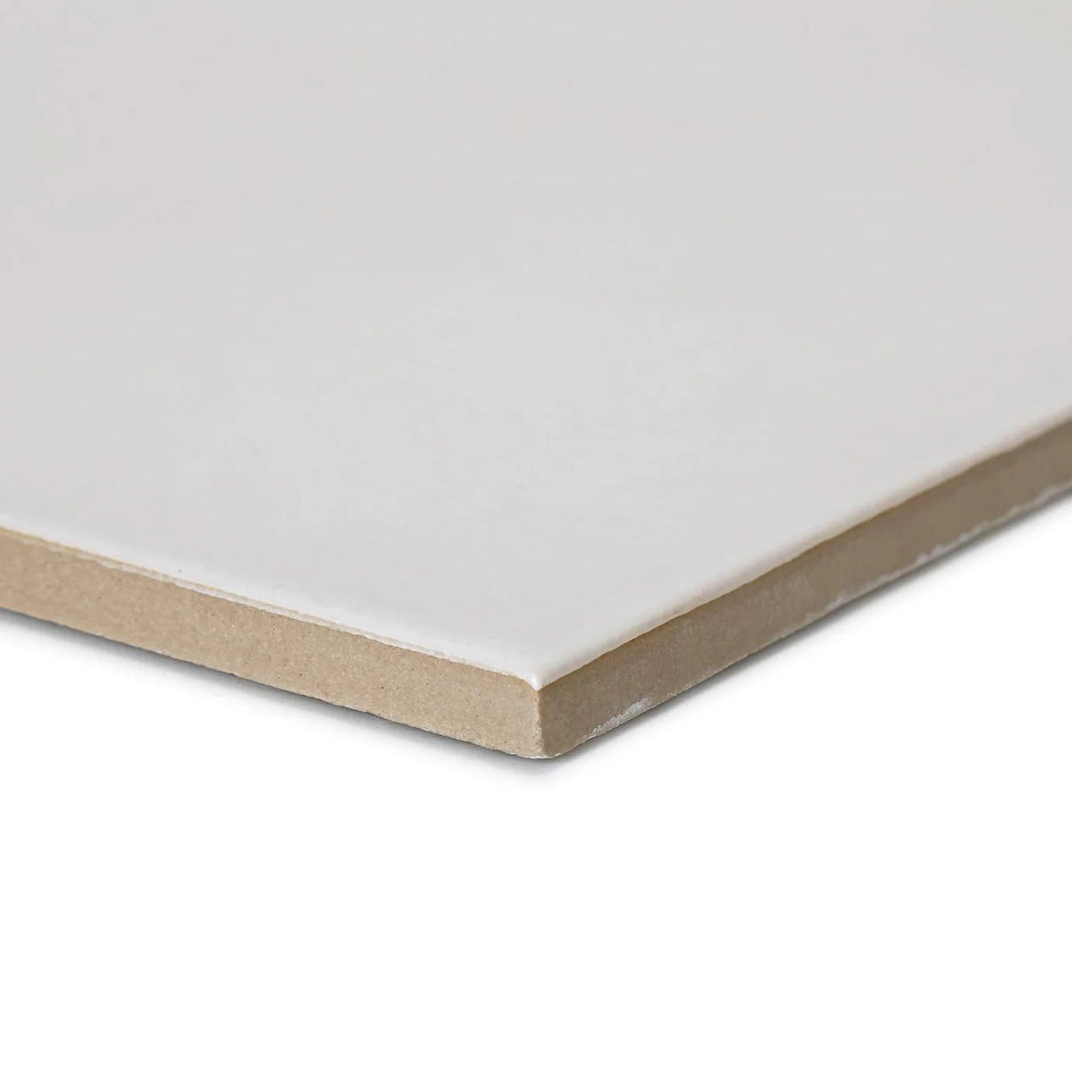 A sleek off-white ceramic casino jackpot plain white tile with a smooth glossy finish and beige substrate edge