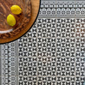 Black and white geometric patterned ceramic casino poker tile with ornate border designs for decorative use