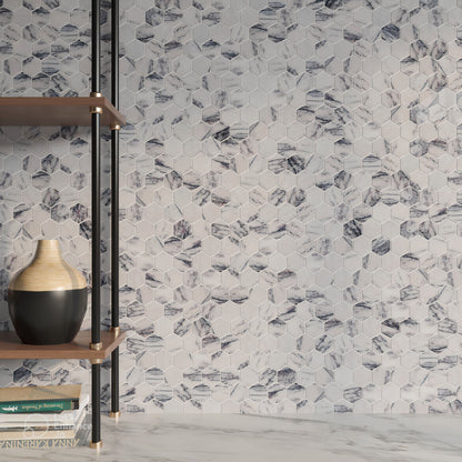 Close detail of polished Calacatta Viola marble hexagons showing aubergine and oxblood veining on ivory