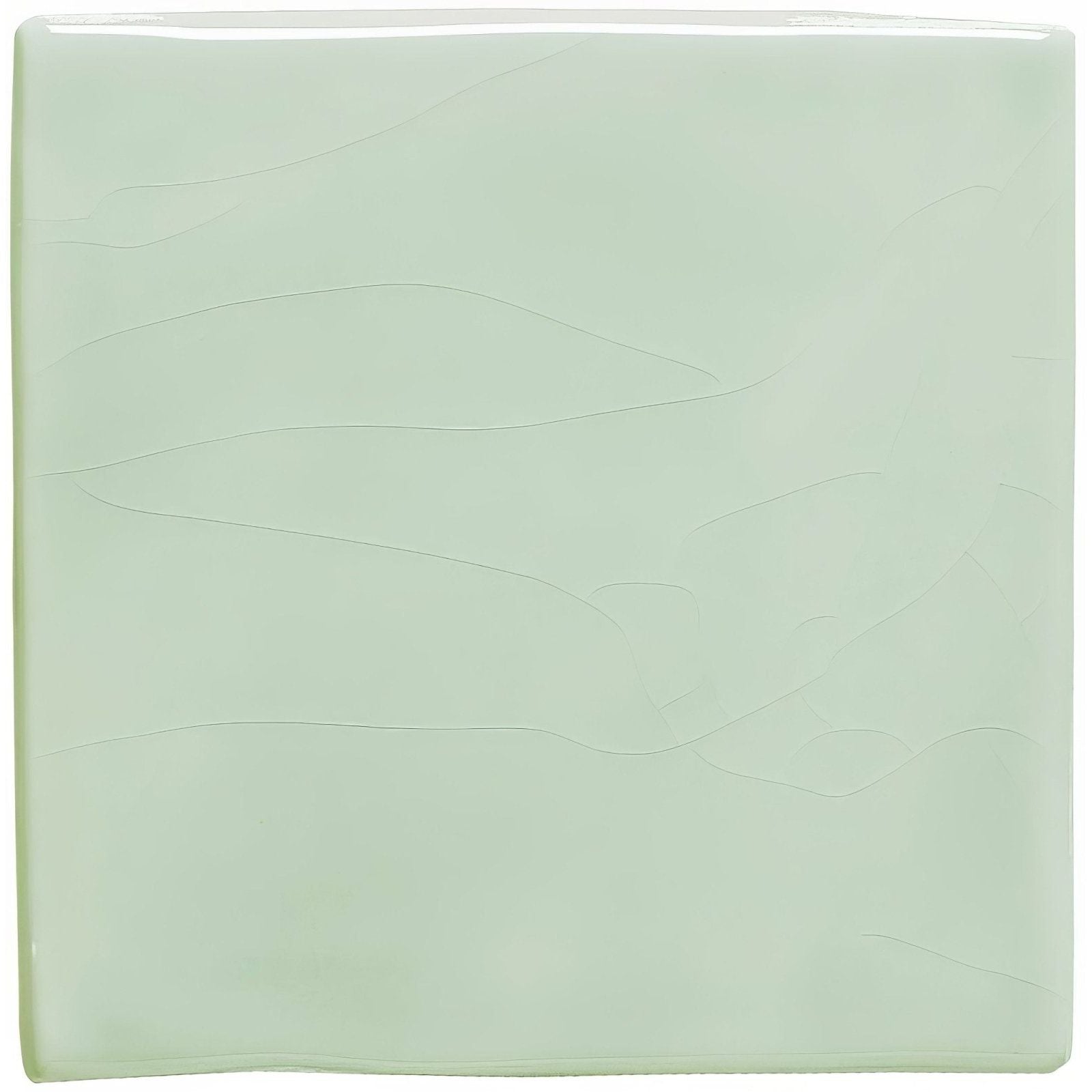 A square translucent mint-green glass tile with subtle wavy embossed patterns celadon field tile