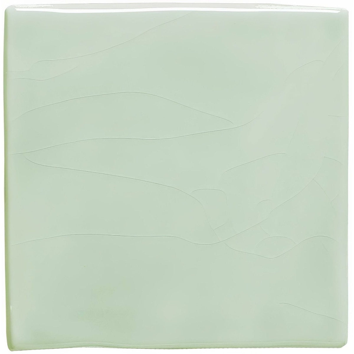 A square translucent mint-green glass tile with subtle wavy embossed patterns celadon field tile